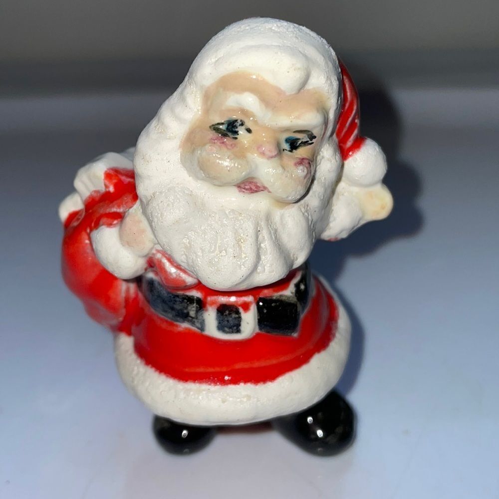 Vintage small ceramic Santa Claus holding sack